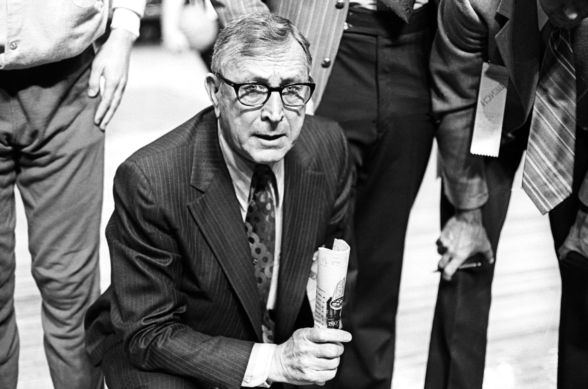 John Wooden Coaching On Basketball Court